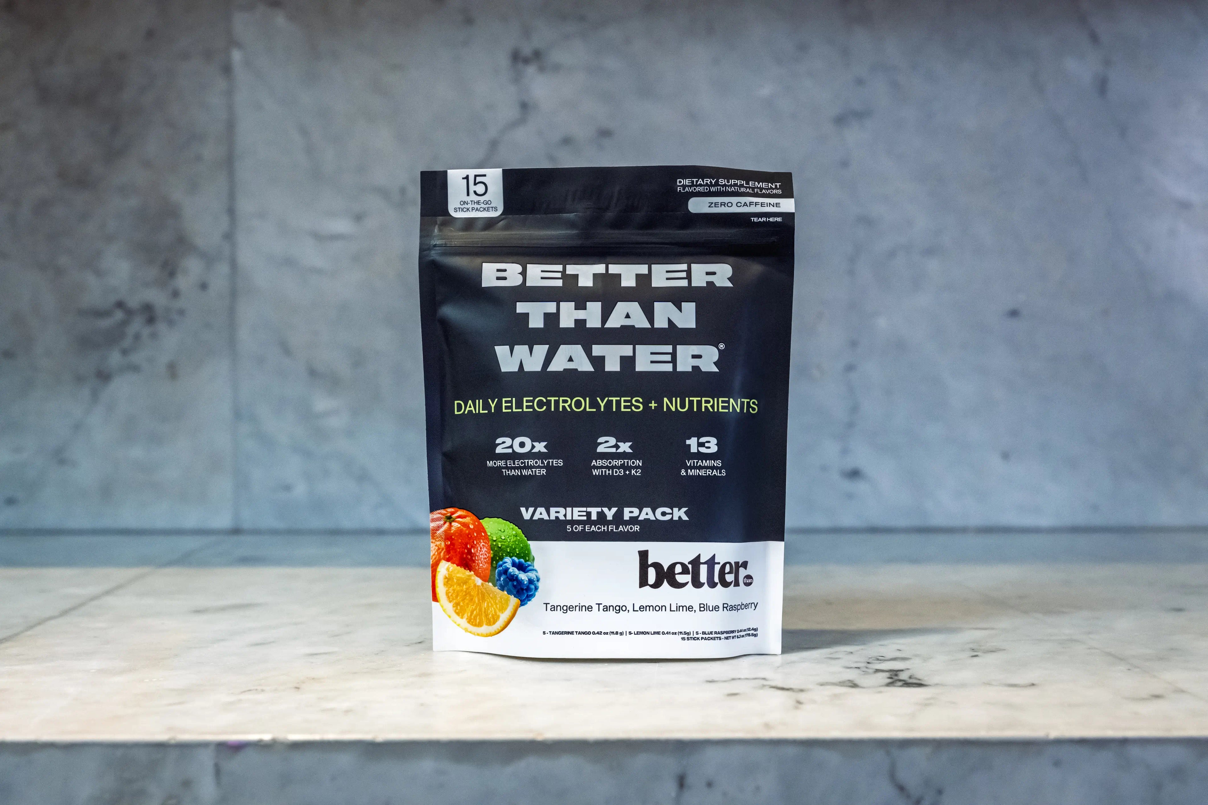 Better Than Water variety pack, Citrus Energy, on a marble surface with a gray background