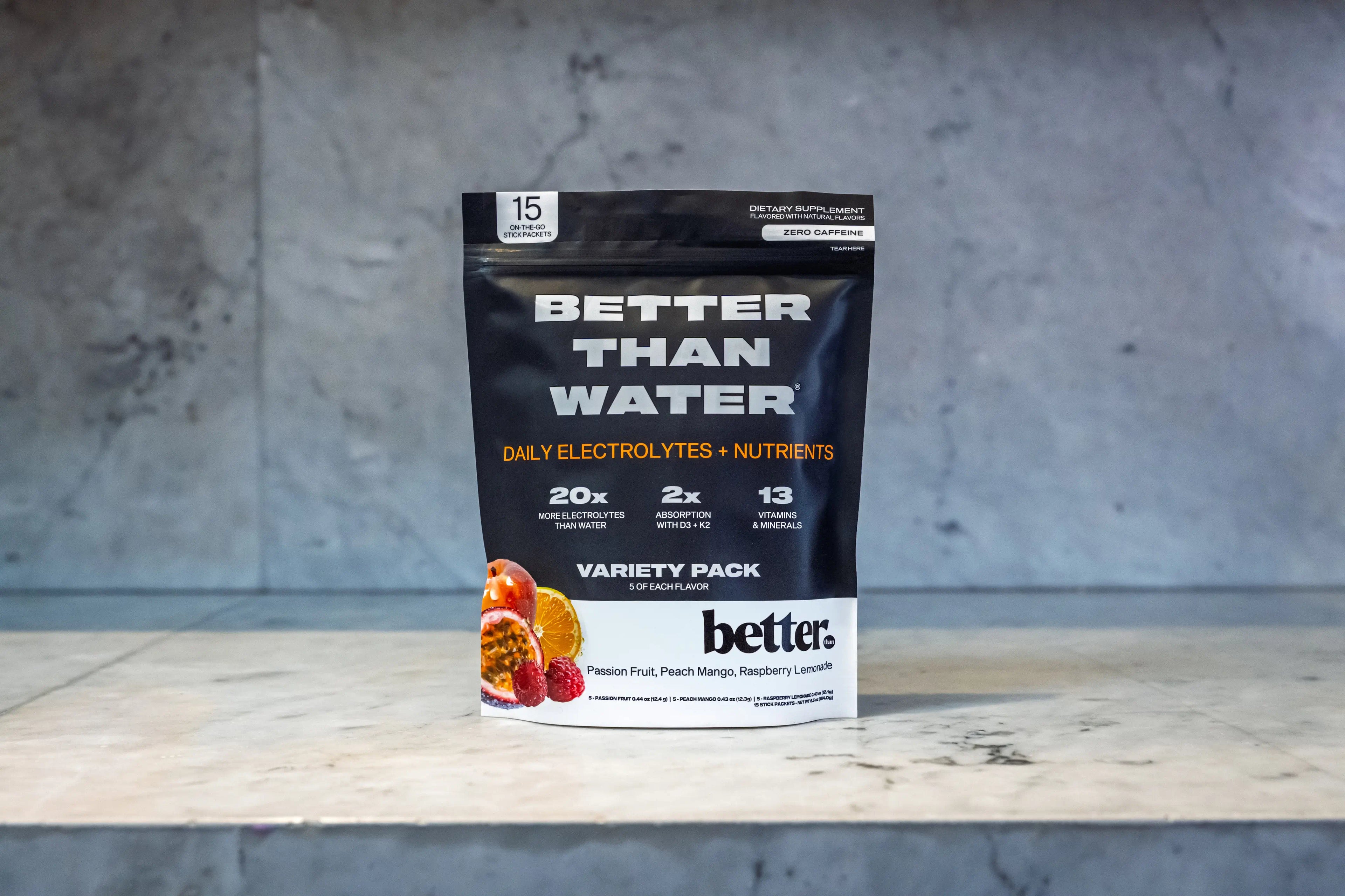 BETTER THAN WATER Variety Pack - Tropical Calm, on a marble surface with a gray background